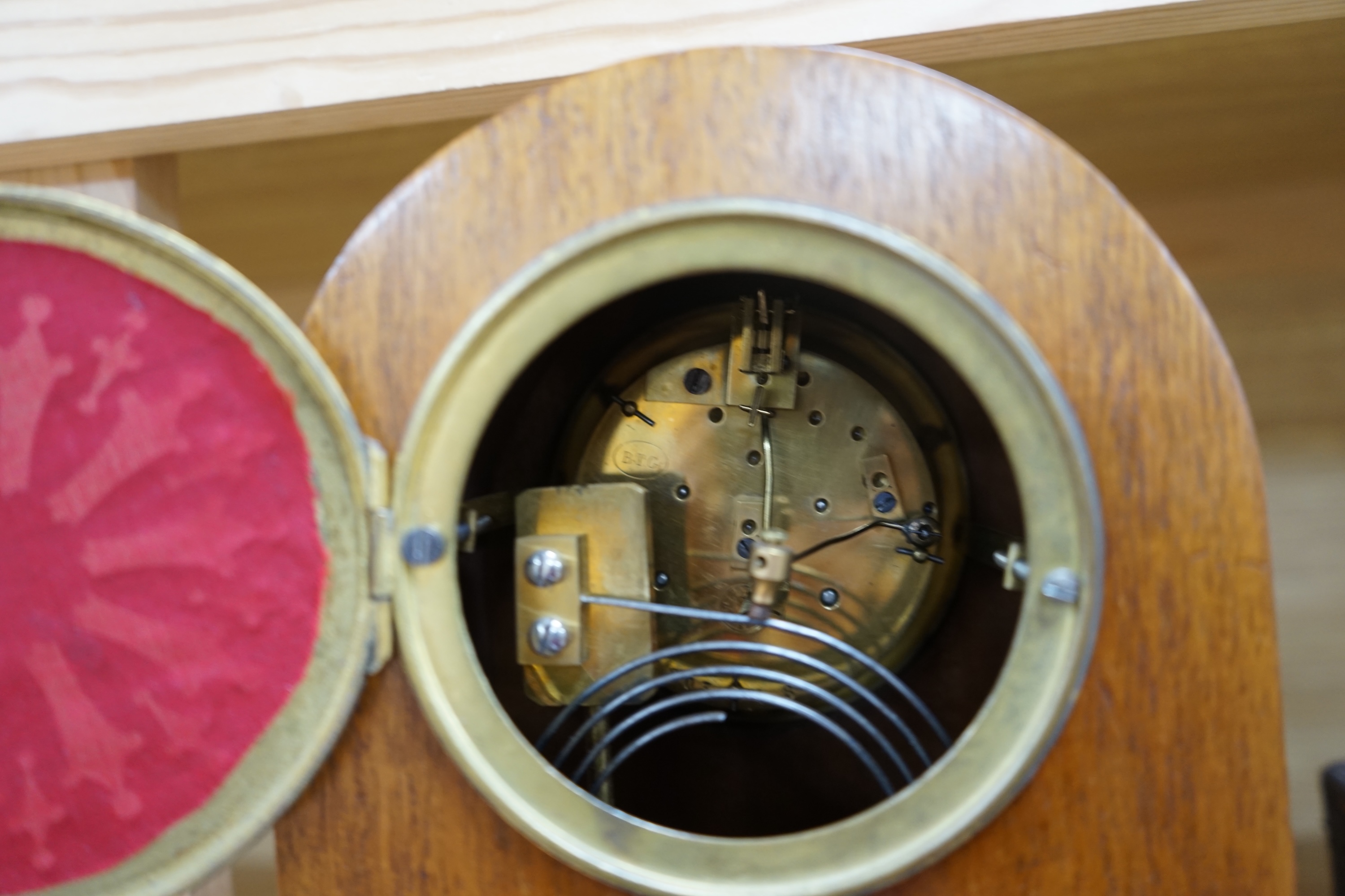 A cased brass carriage timepiece and a dome topped Edwardian mantel clock striking on a coiled gong, backplate stamped BTG, 29.5cm (2) Condition - fair to good.